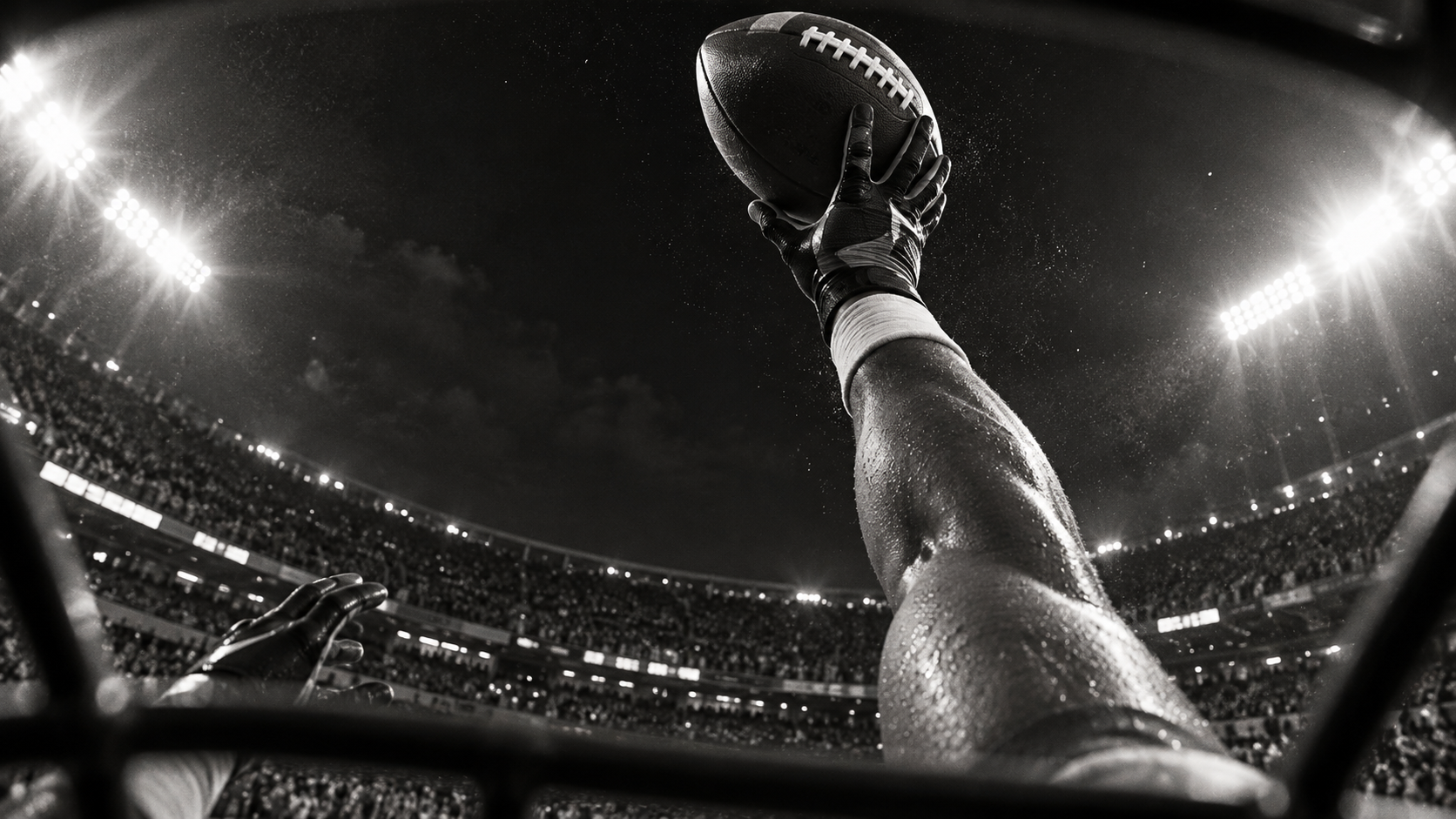 Cinematic inside-helmet POV of a receiver reaching overhead for a one-handed catch.